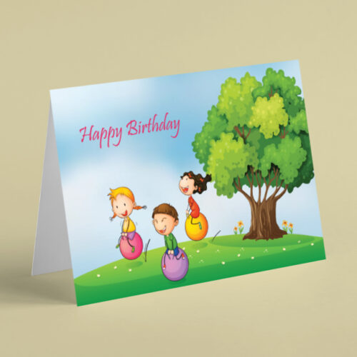 Children playing on space hoppers birthday card